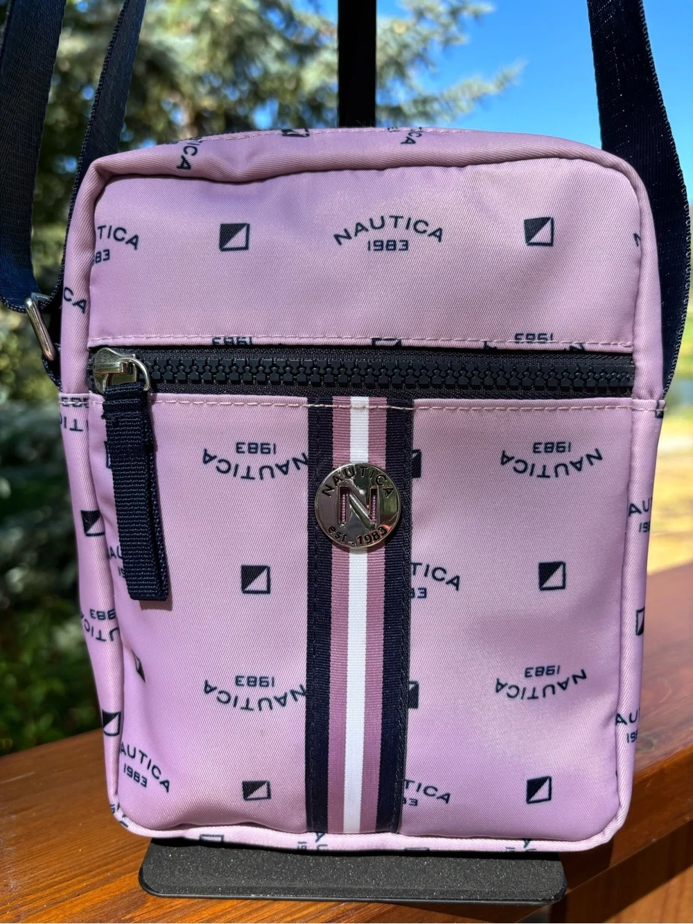 Nautica Pink Logo Print Crossbody Bag with Navy Strap and trim.
